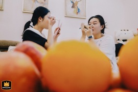 Bridesmaids prepare for the day by applying their makeup in the morning in Kaifeng, China.